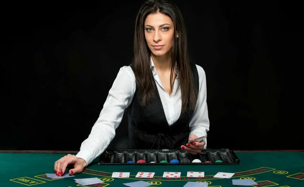 Tampilan meja live dengan dealer dan area taruhan